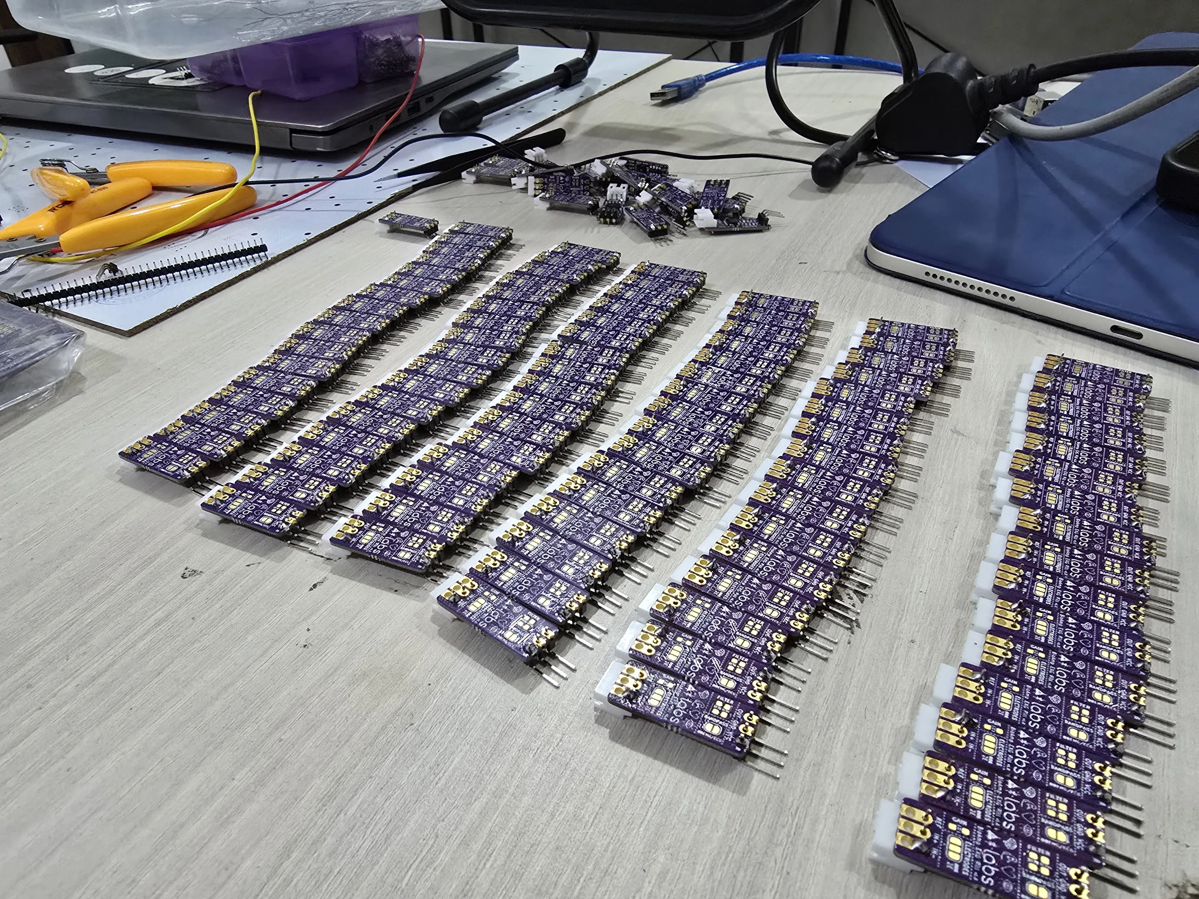 IMG-20260aRows of assembled electronic circuit boards prepared for testing and deployment in the lab.309-WA0036