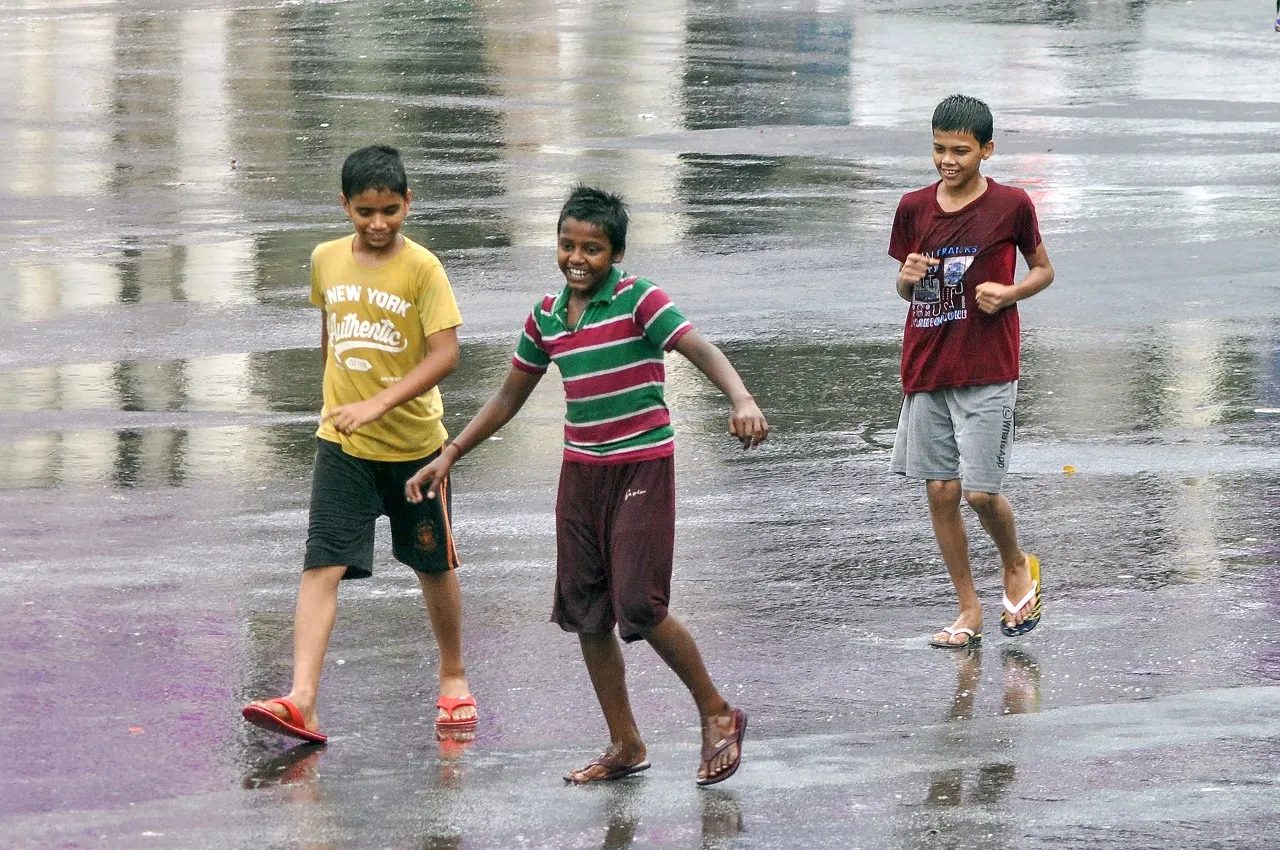Children seen playing during rain in Lucknow
