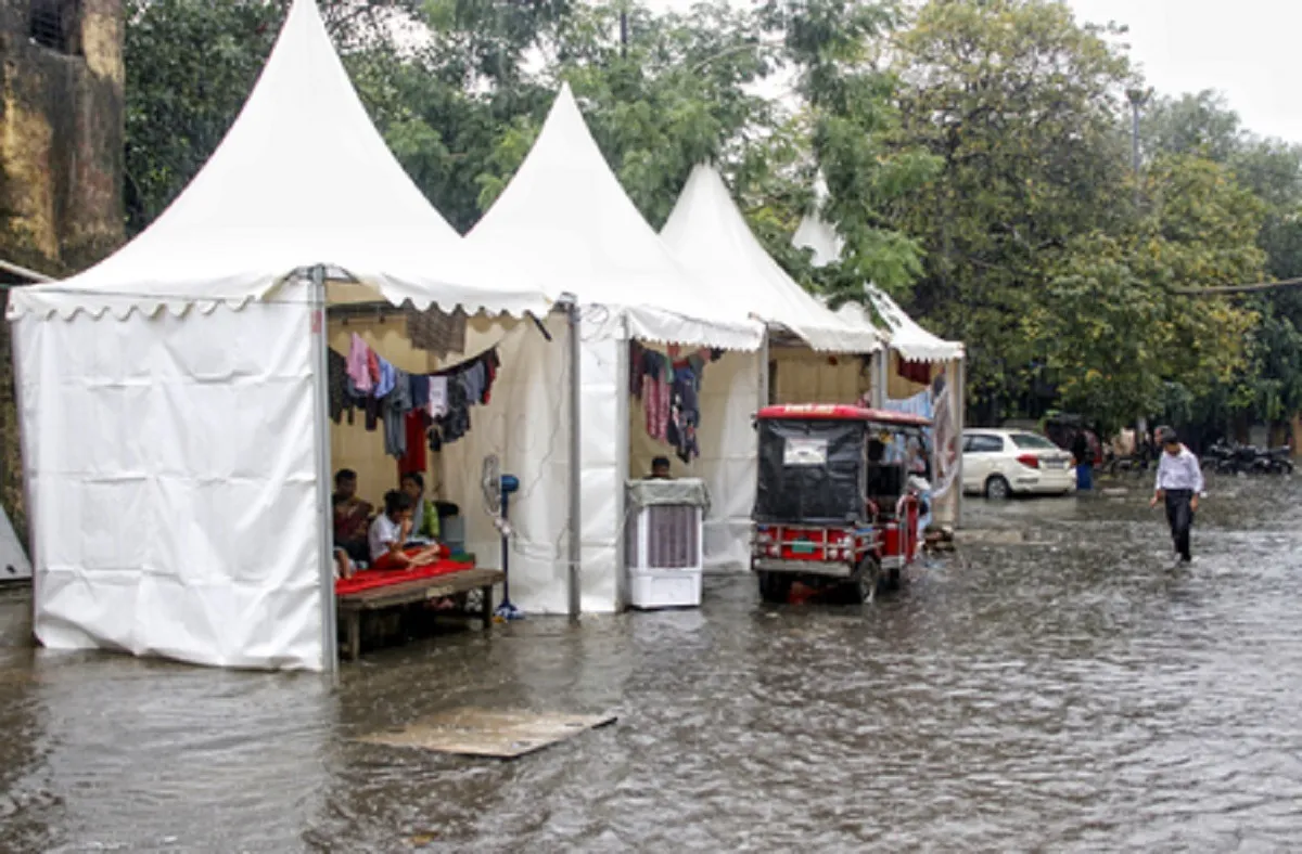 People take shelter inside a temporary relief camp