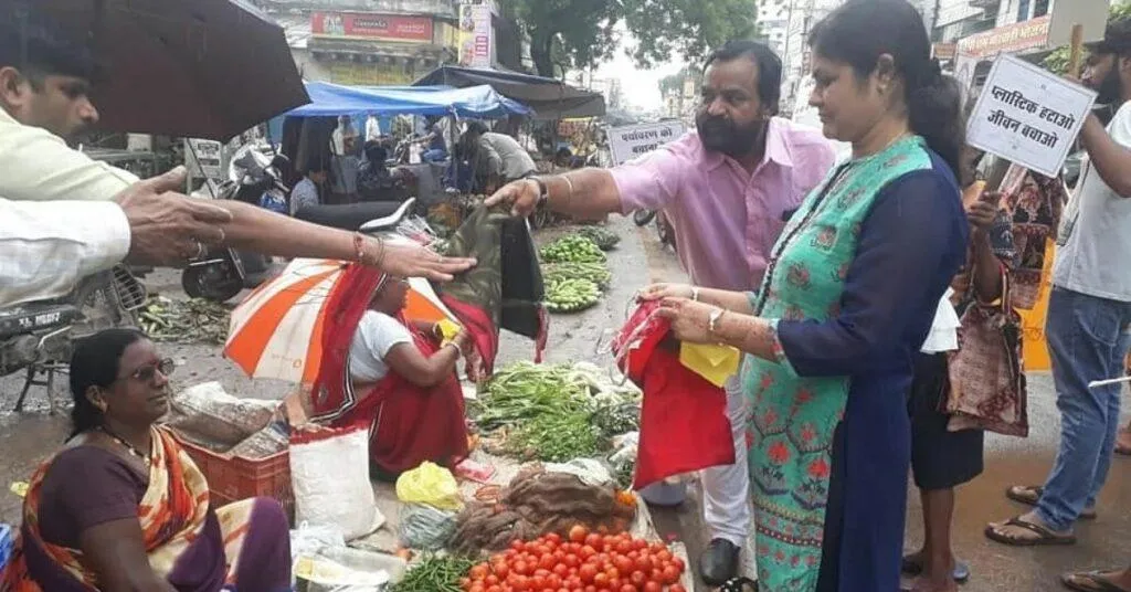 Couple deliver cloth bags