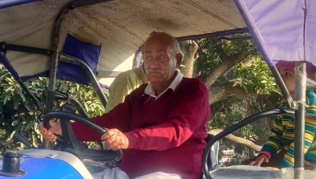Prem Chand on a tractor