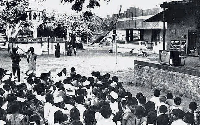 Villagers curiously watching TV programme during SITE