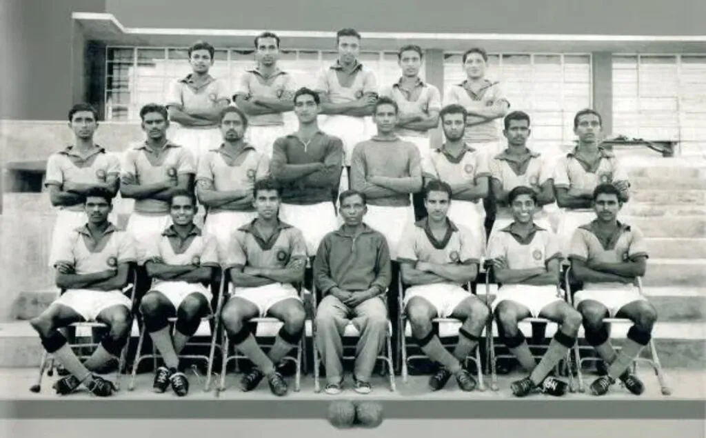 Indian coach Syed Abdul Rahim sitting in the first row with the football team (center).<br />
