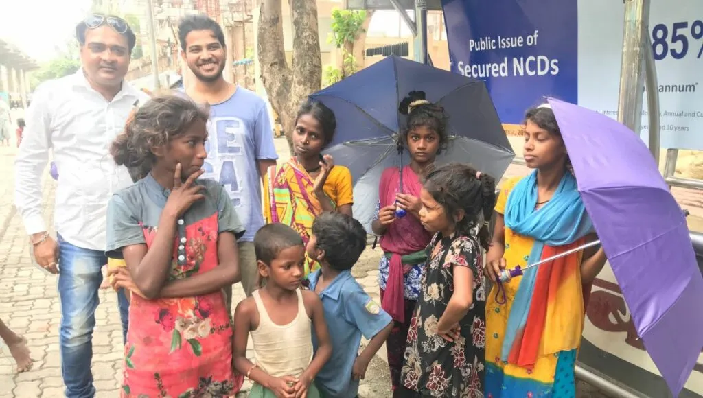 Vimal during Umbrella distribution 