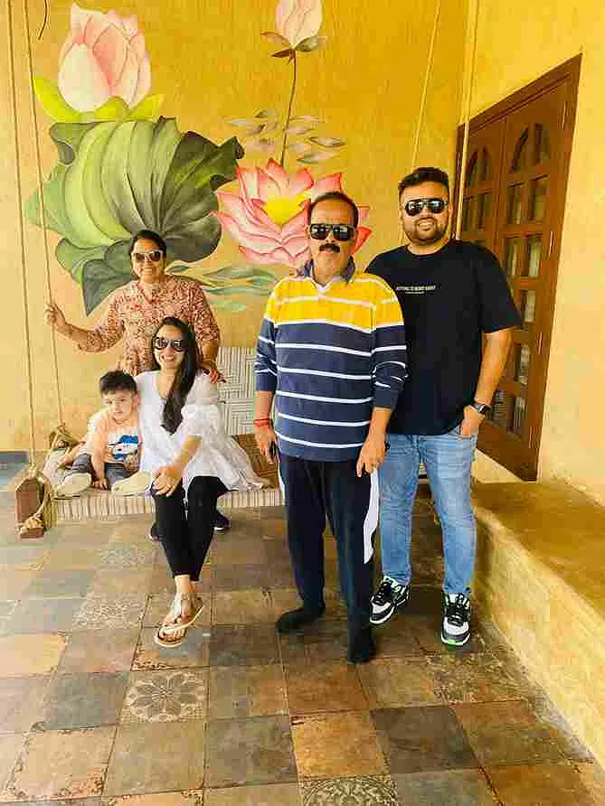 The Jain family outside their sustainable home