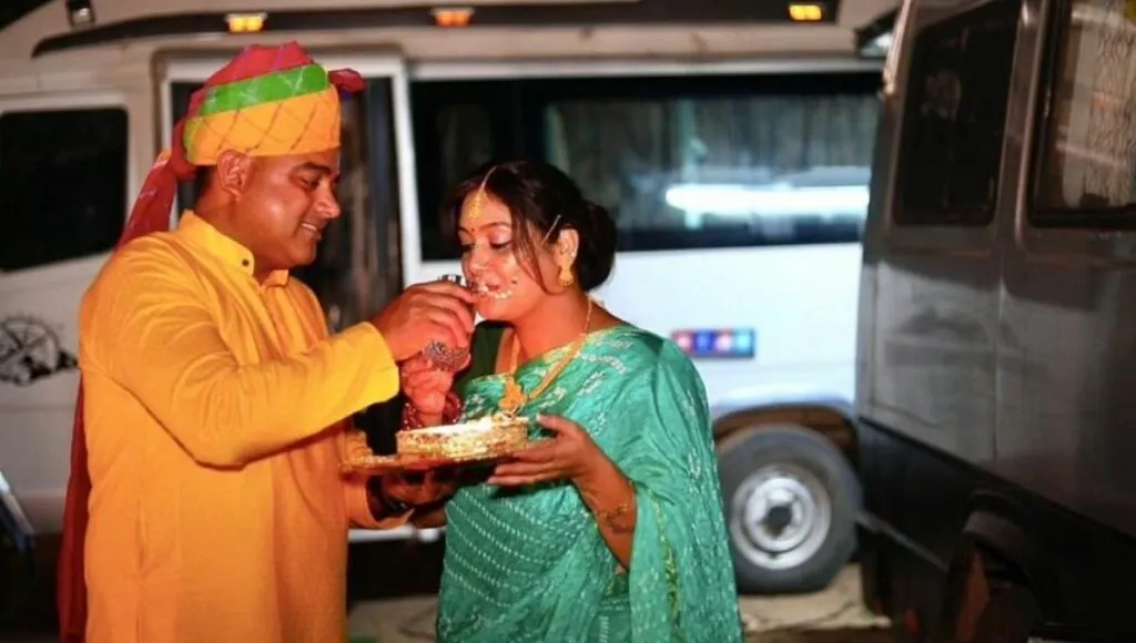 Deepak and Ruchi celebrate a festival during one of their trips.<br />
