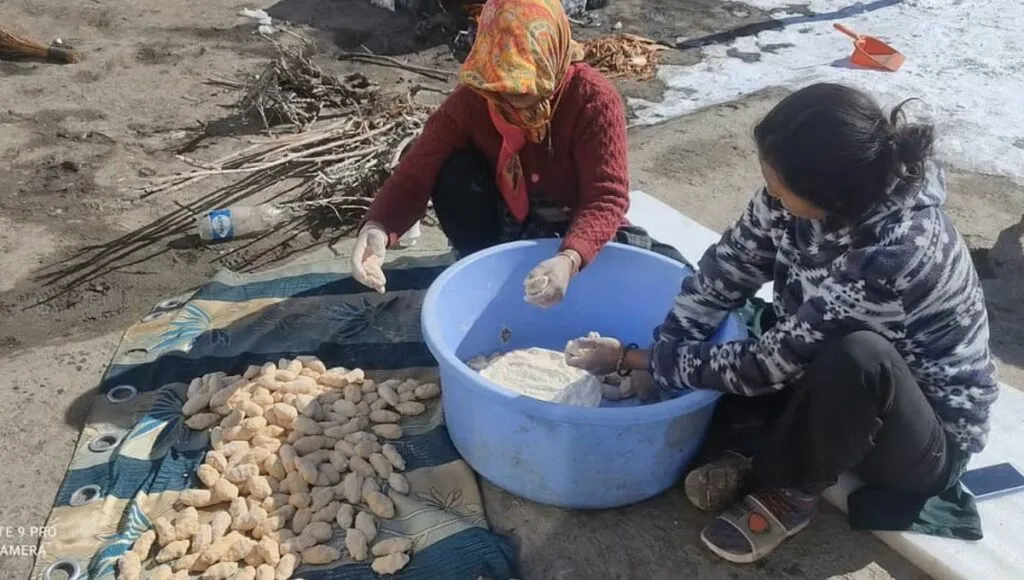 Women in Sipiti  making food for dogs 
