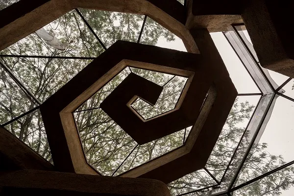 The spiral ceiling at Chuzhi is made with plastic bottle beams stacked with earth,