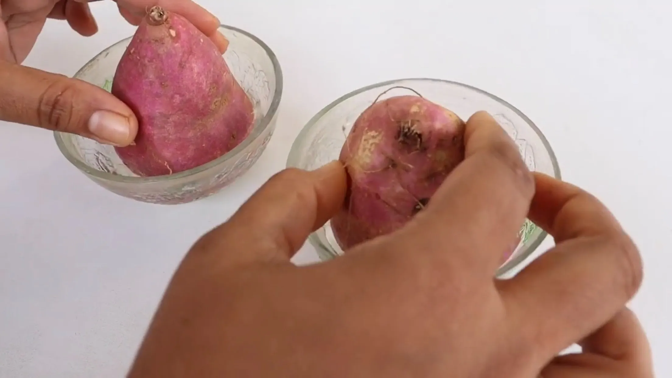 Place two halves in separate bowls filled with water