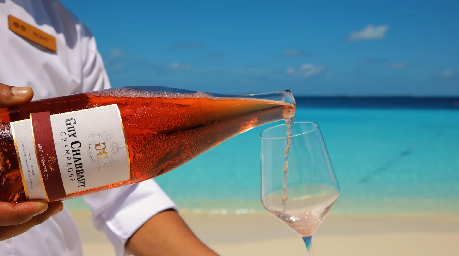 Champagne moments shared over culinary delights by the turquoise ocean
