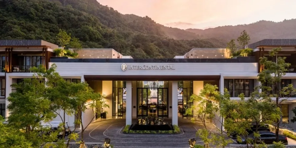 A building with trees and mountains in the background

AI-generated content may be incorrect., Picture