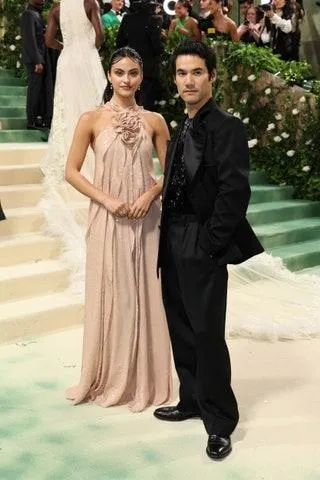 Image may contain Joseph Altuzarra Camila Mendes Adult Person Wedding Formal Wear Clothing Dress Suit and Footwear