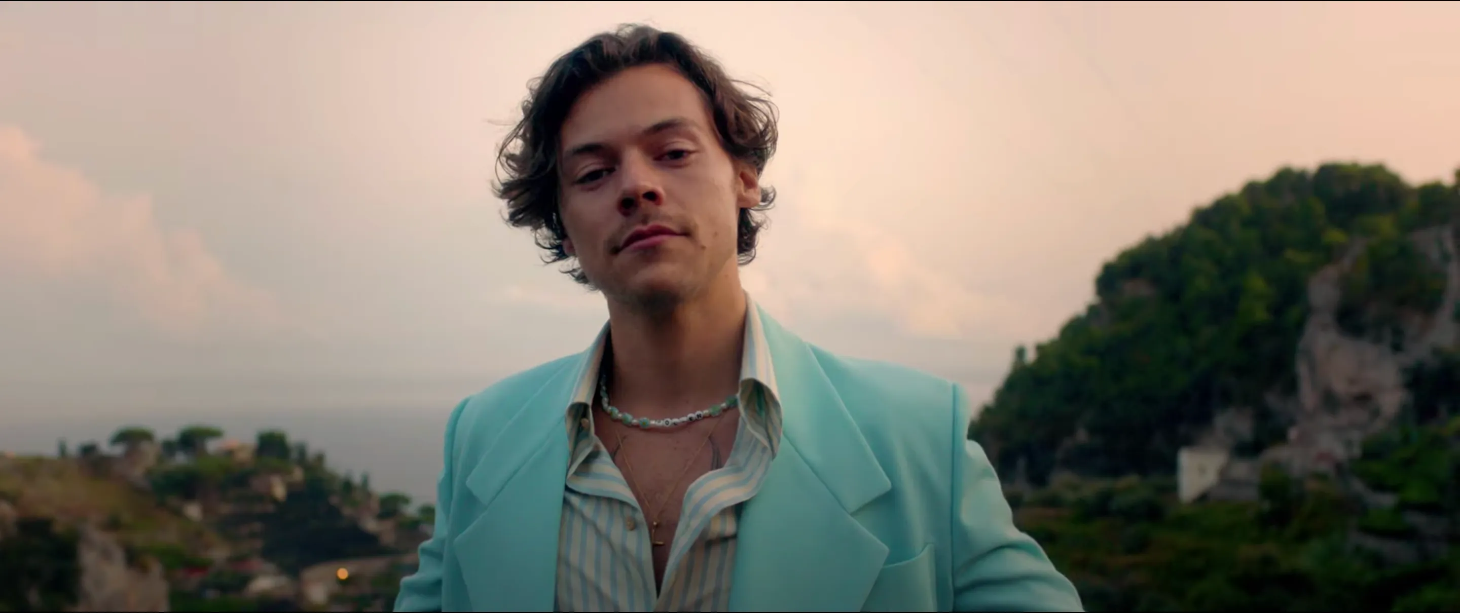 Catch Harry Styles' Long Locks Flowing in the Wind One Last Time in His New  "Golden" Music Video