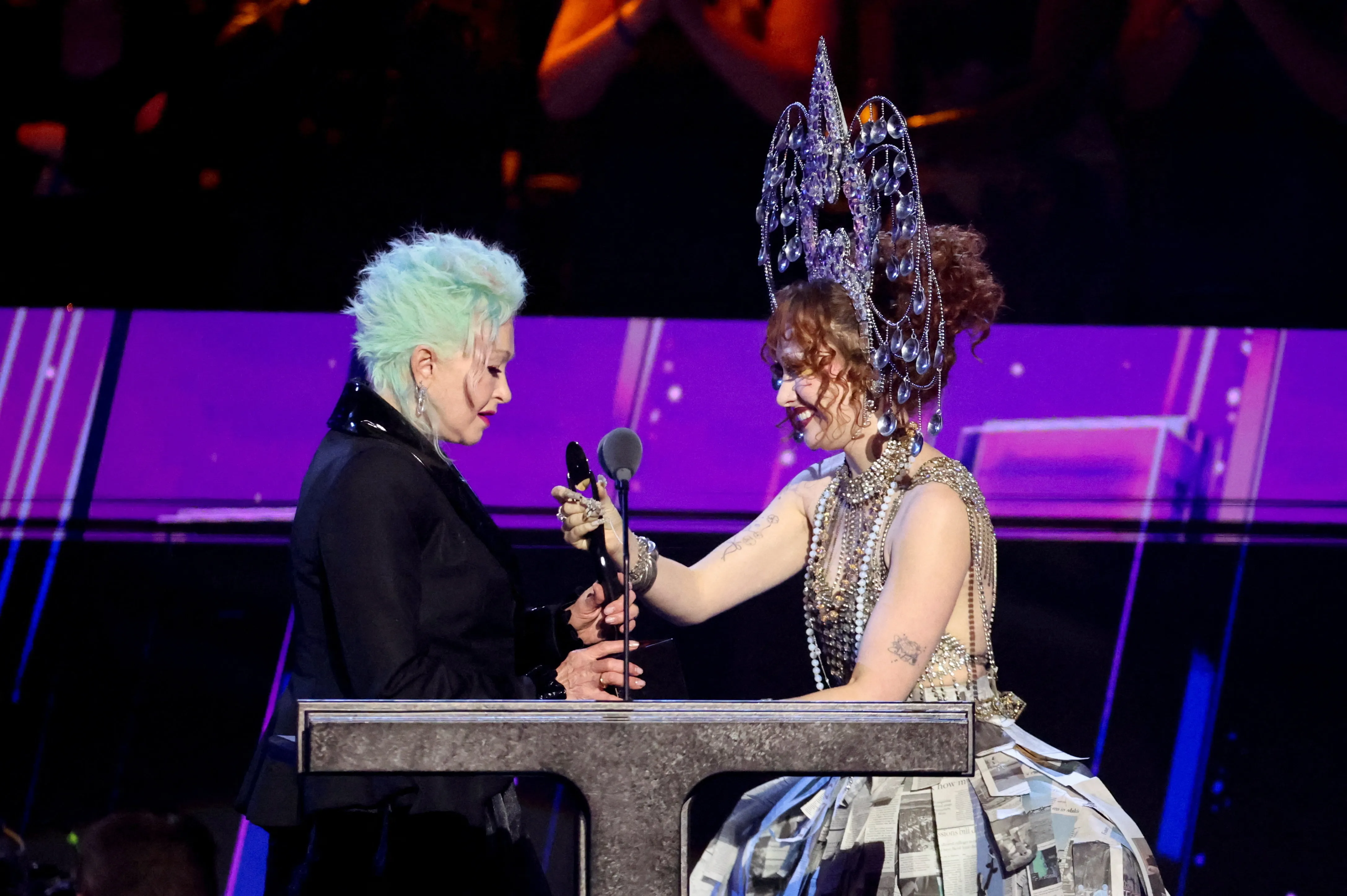 Chappell Roan honors Cyndi Lauper in newspaper skirt at Rock & Roll Hall of  Fame