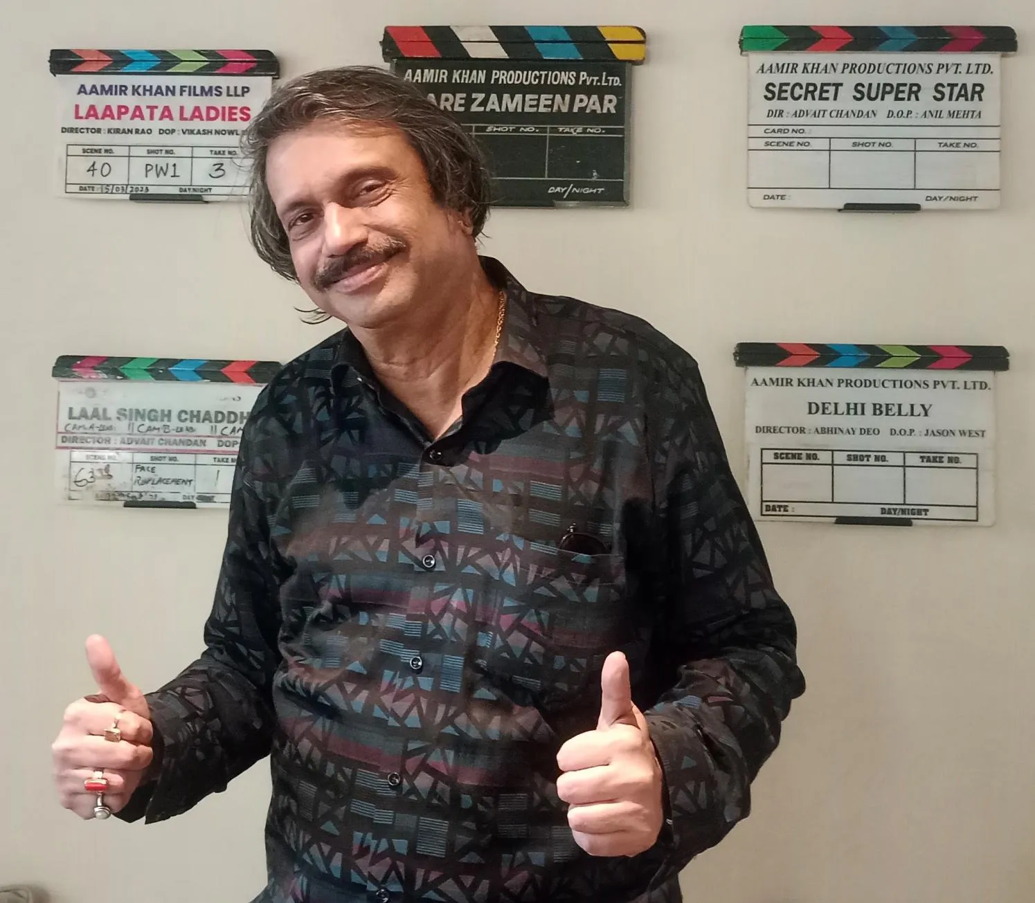Aamir Khan's production office wall--movie clapper boards