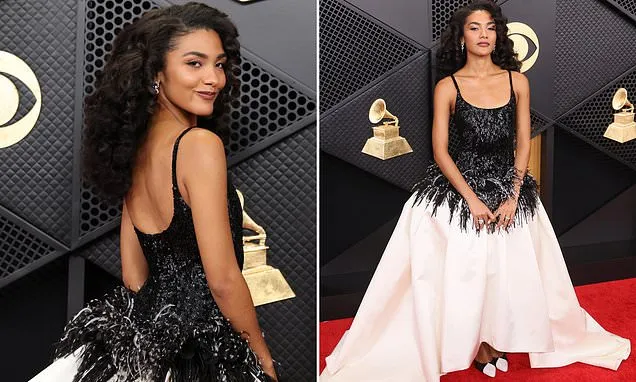 Olivia Dean catches the eye in a feathered black and white Chanel gown as  she hits the red carpet for the 2026 Grammy Awards | Daily Mail Online