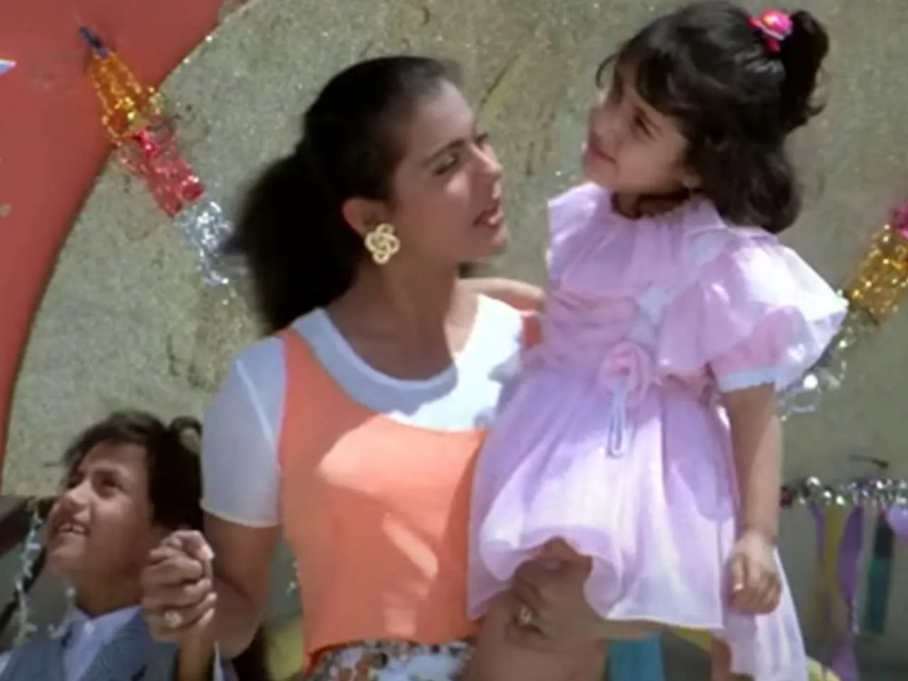 This child actor in Kajol's arms appeared in Ishq, now gives blockbuster  with Aamir Khan; can you recognise her?