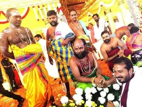  jai anand wedding function - two religious celebrities shaking hands