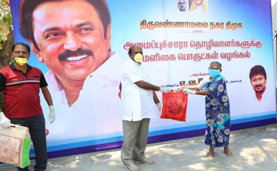 corona virus Impact - DMK EV velu giving Grocery products to people 