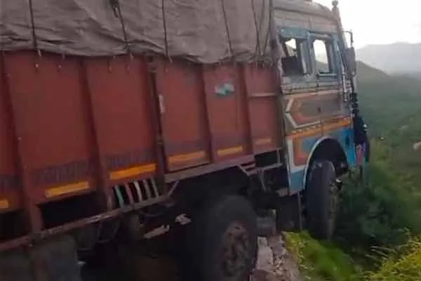 lorry hanging in the distance at the top of the 800-foot mountain