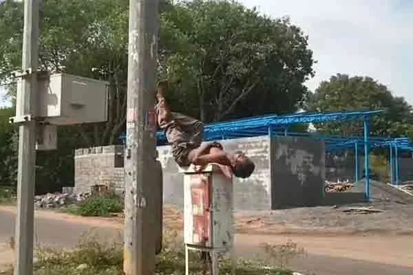 Drunk man lying on EB breaker box in Neyveli