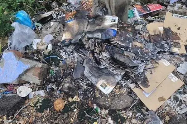 Hundreds of postcards thrown on the road in Kalugumalai