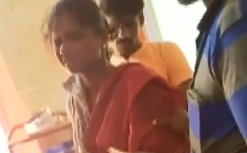 security guard injecting a patient in a government hospital