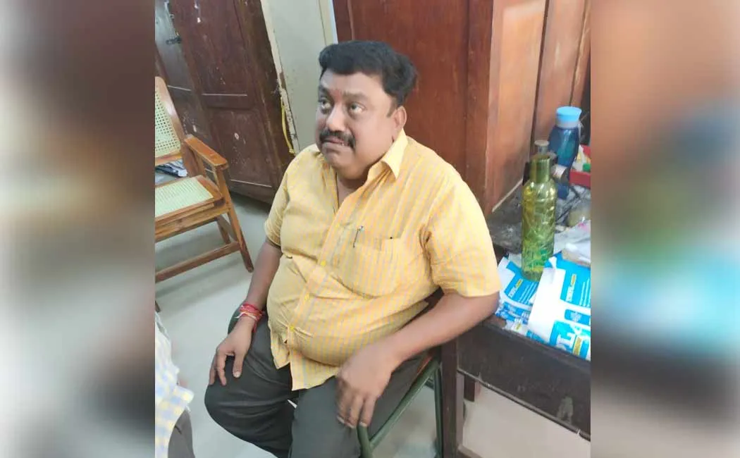 registrar who took the bribe was caught red handed