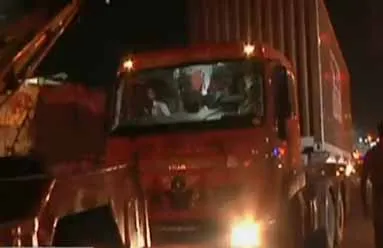 container lorry puncher in middle of the road 