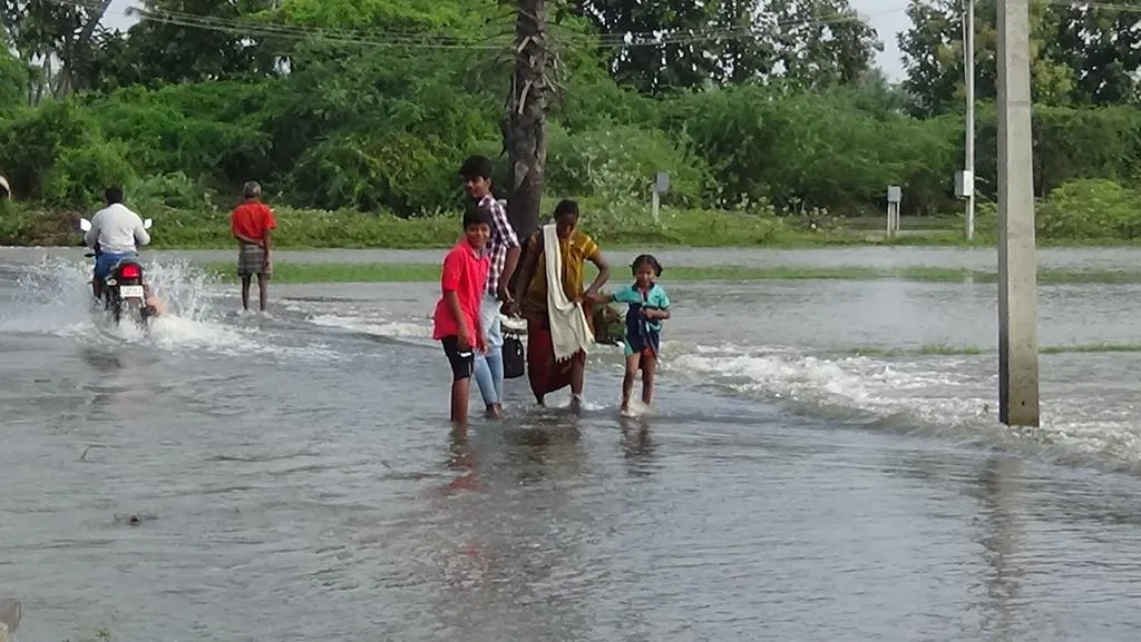 The town of Erode is surrounded by rain water 