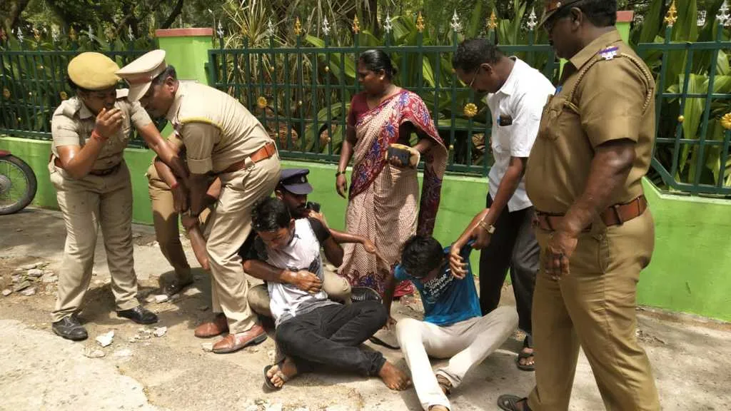   women tried to fire in front of Collector's office