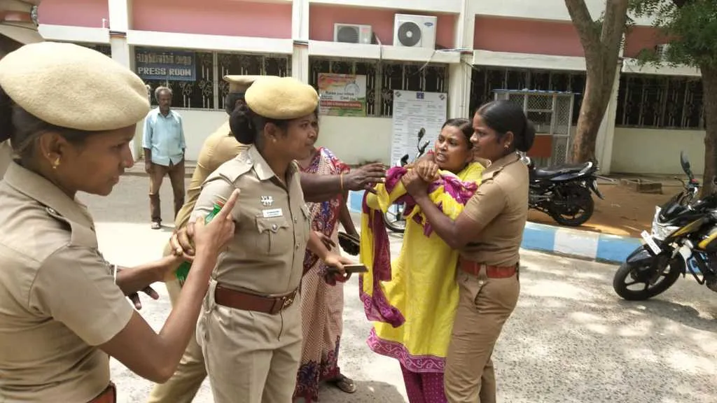   women tried to fire in front of Collector's office