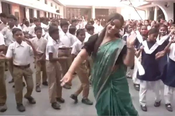  Teacher dances with students in school to a song on Lord Rama called Jaya Shriram