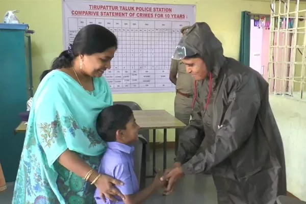  District Collector son who presented the raincoat to the Assistant Inspector of Police