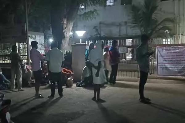 People waiting at the door of ration shop at night to renew Aadhaar card!