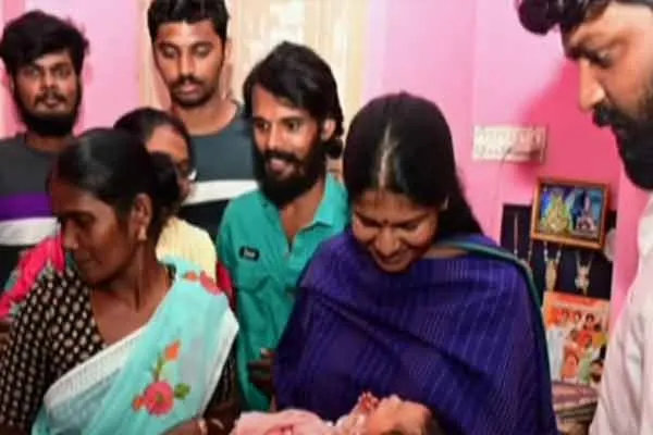 A child born to a woman who survived the flood; Kanimozhi fulfilled the wish of the family