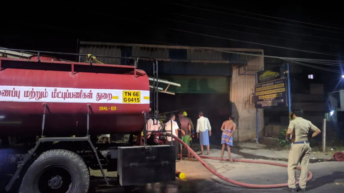 At night in Ambattur, the car service center is fire