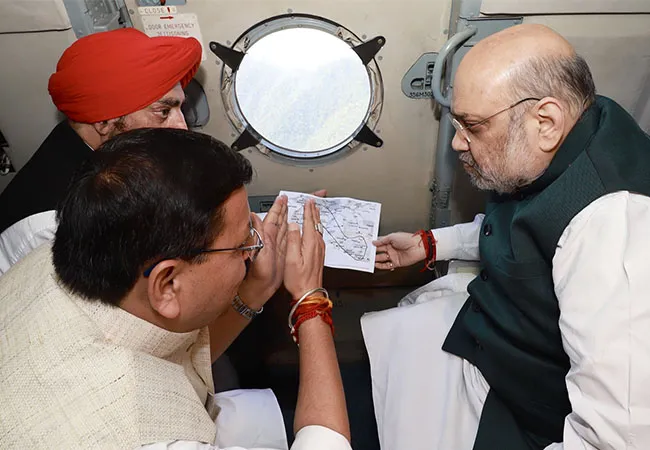 Amitsha inspecting flood-affected areas by helicopter