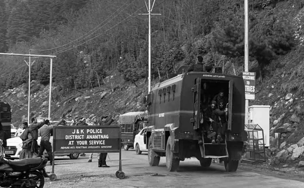 A crying son hugging his father's body at pahalgam incident