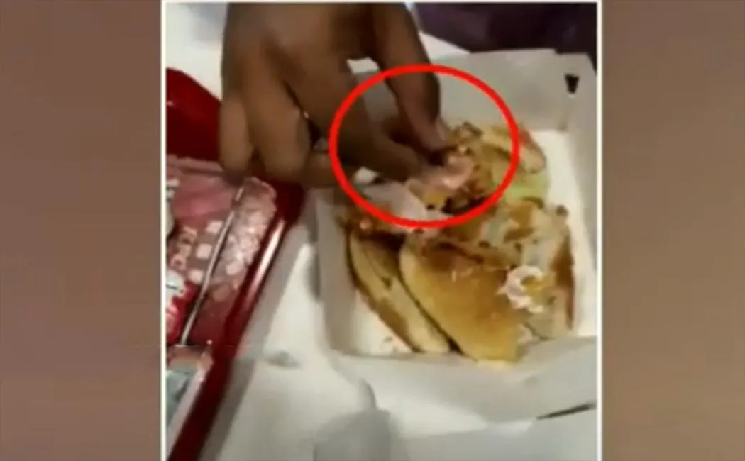 Plastic glove on burger... viral video!