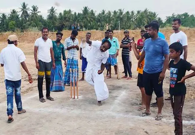 The minister who threw the ball ... the legislator who batted!