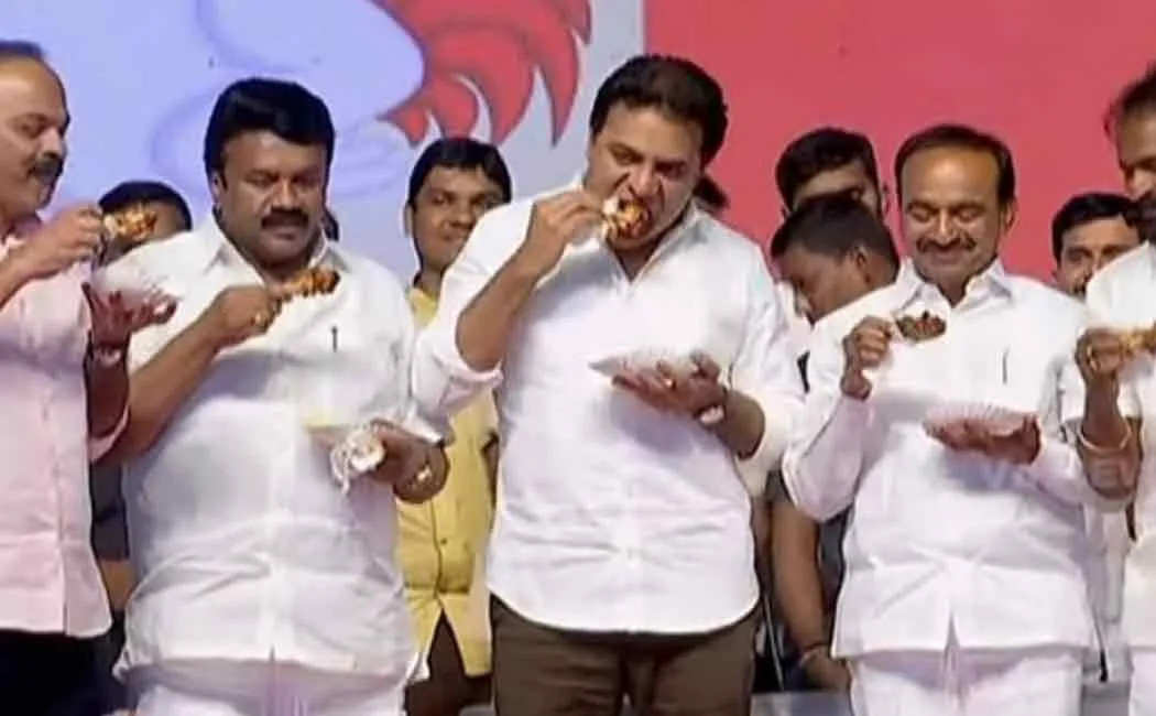 telangana ministers eat chicken in stage to create awareness among people