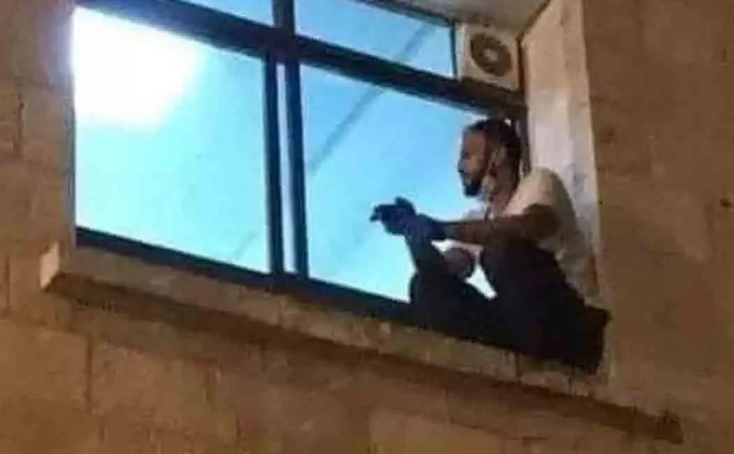 palestine son watches his mother from hospital window