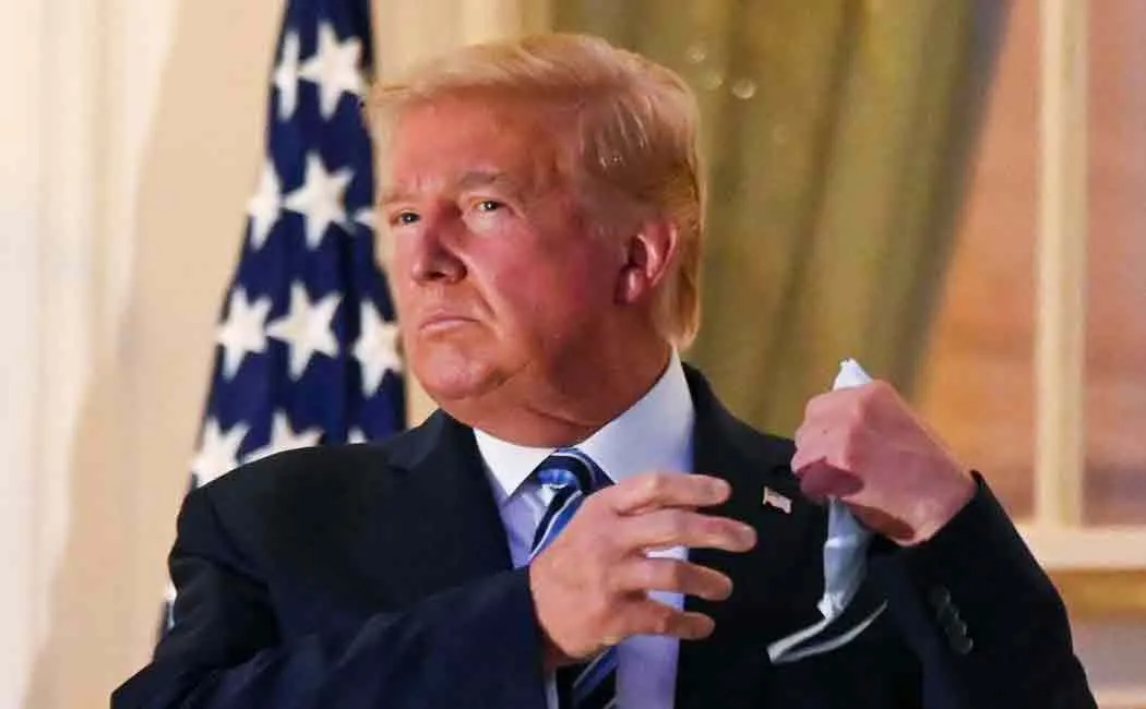 trump removes mask after returning to white house