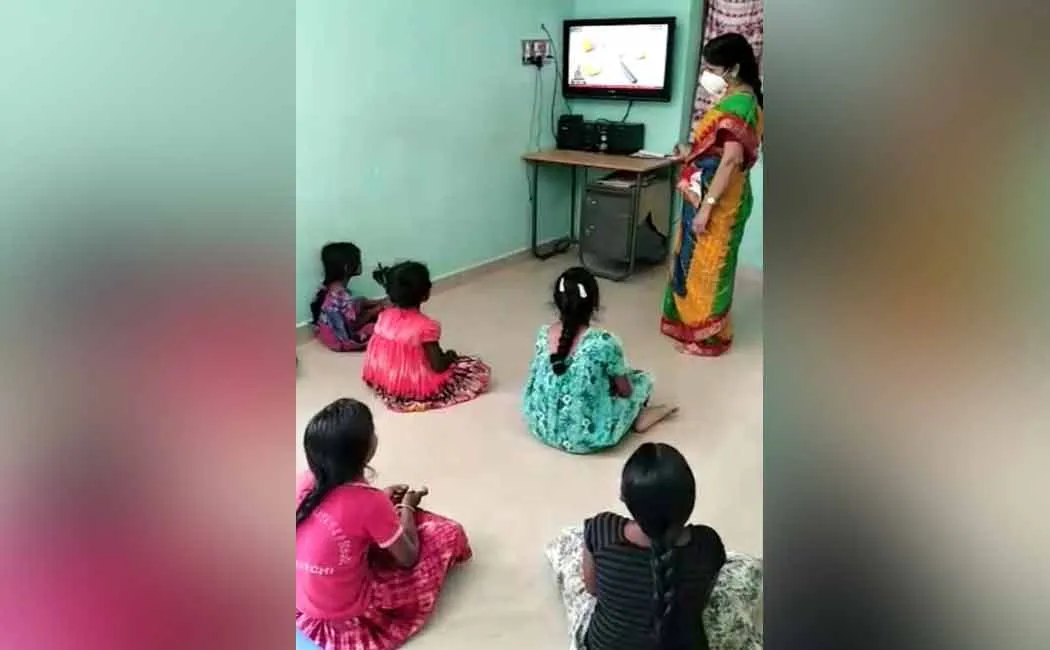 Teacher visiting students home to teach them 
