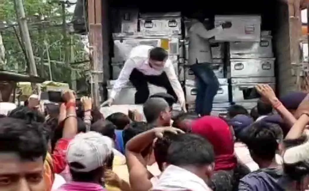 voting machine boxes caught by people 