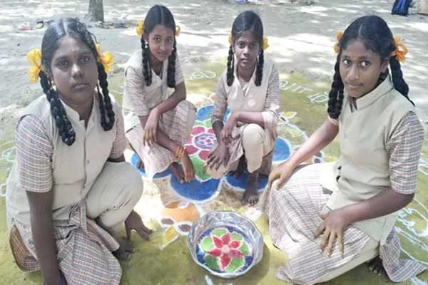 Golem floating on water Pongal greetings in Tamil writing Govt school girls are amazing
