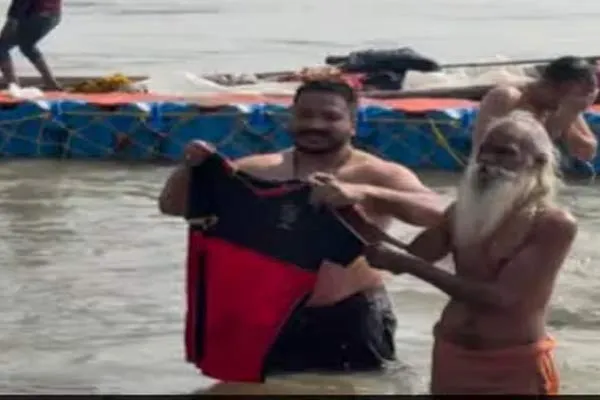 RCB Fan's soaked jersey at Kumbh Mela in uttar pradesh