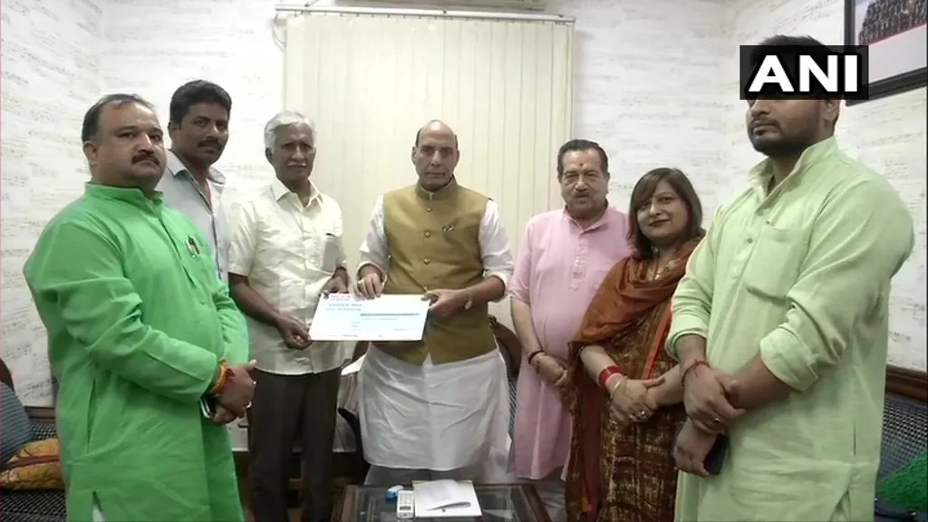 indian airforce former chief prasad donate rs 1.08 crores and meet defence minister rajnath singh 