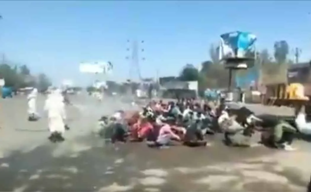 Mass migrants labours are disinfected by spraying sanitizer in Uttar Pradesh